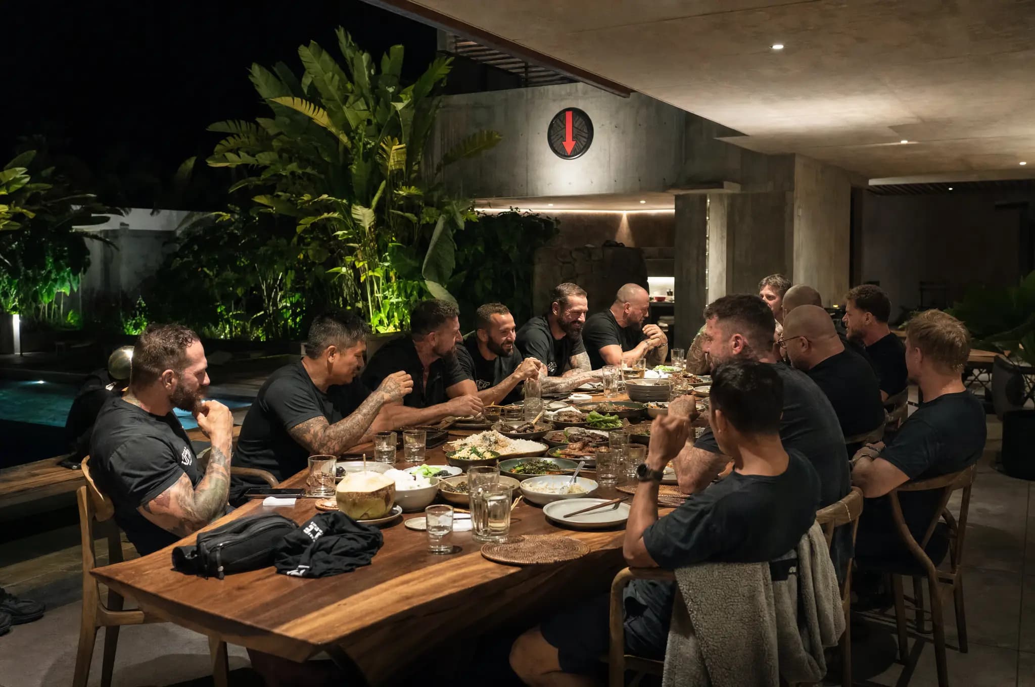 The founding cohort sharing dinner at the villa after training